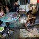 Women play bingo inside a house in Quezon City in Manila.